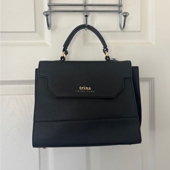Sleek Sophisticated Trina Turk Black Handbag or Crossbody with Gold Hardware - Picture 4 of 11